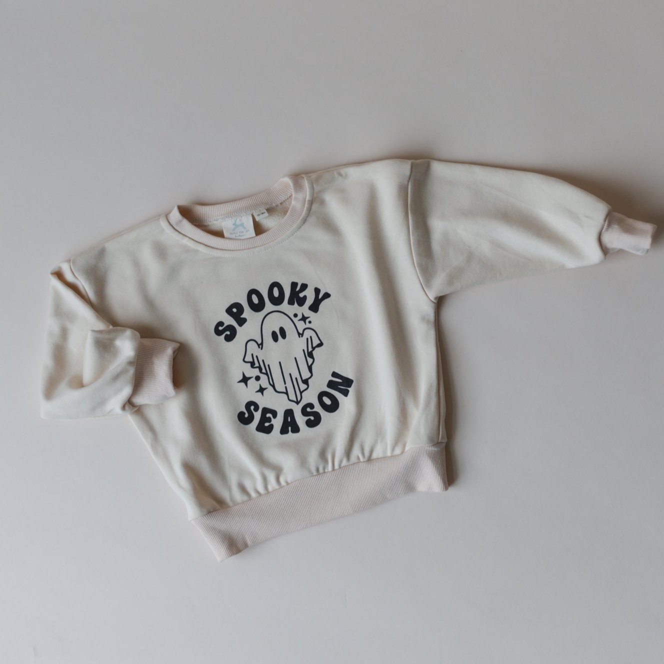 Oversized crewneck sweatshirt with a retro ghost graphic and Spooky Season lettering