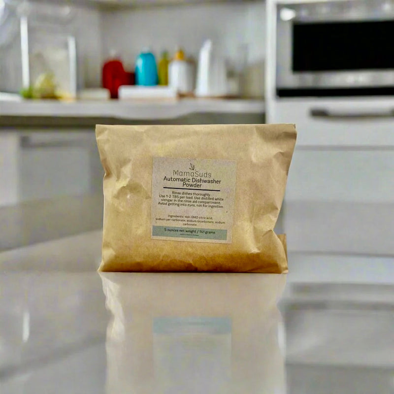 Eco-friendly Automatic Dishwasher Powder in brown paper bag on kitchen counter.