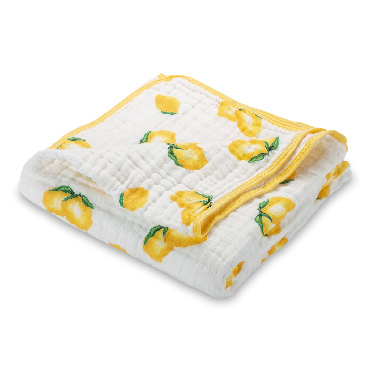 Square muslin baby quilt in white with a bright yellow lemon print, spread out flat