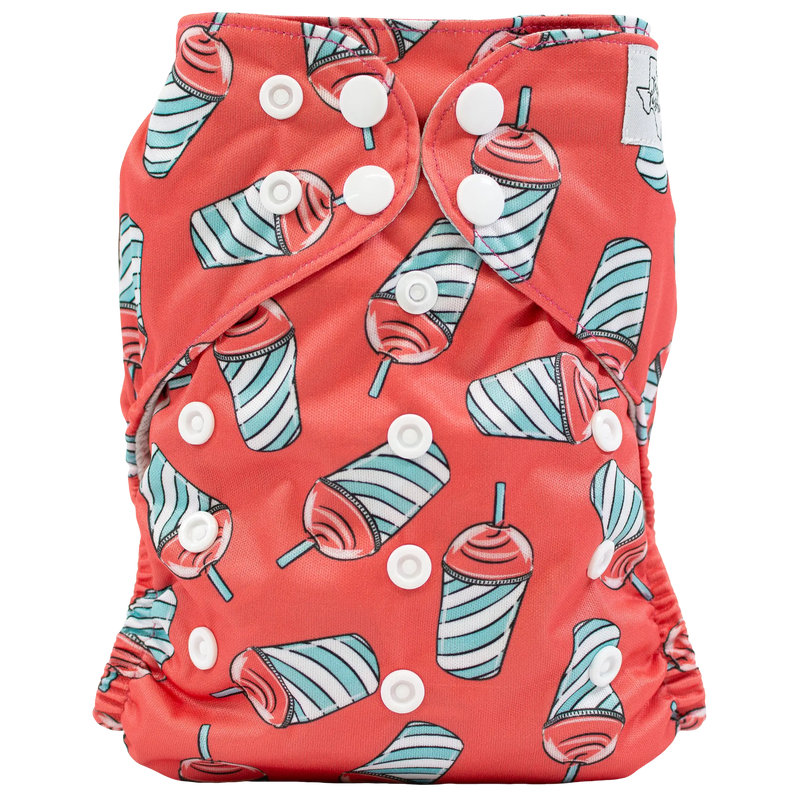 Slim fit pocket cloth diaper with colorful drink design and adjustable snaps.