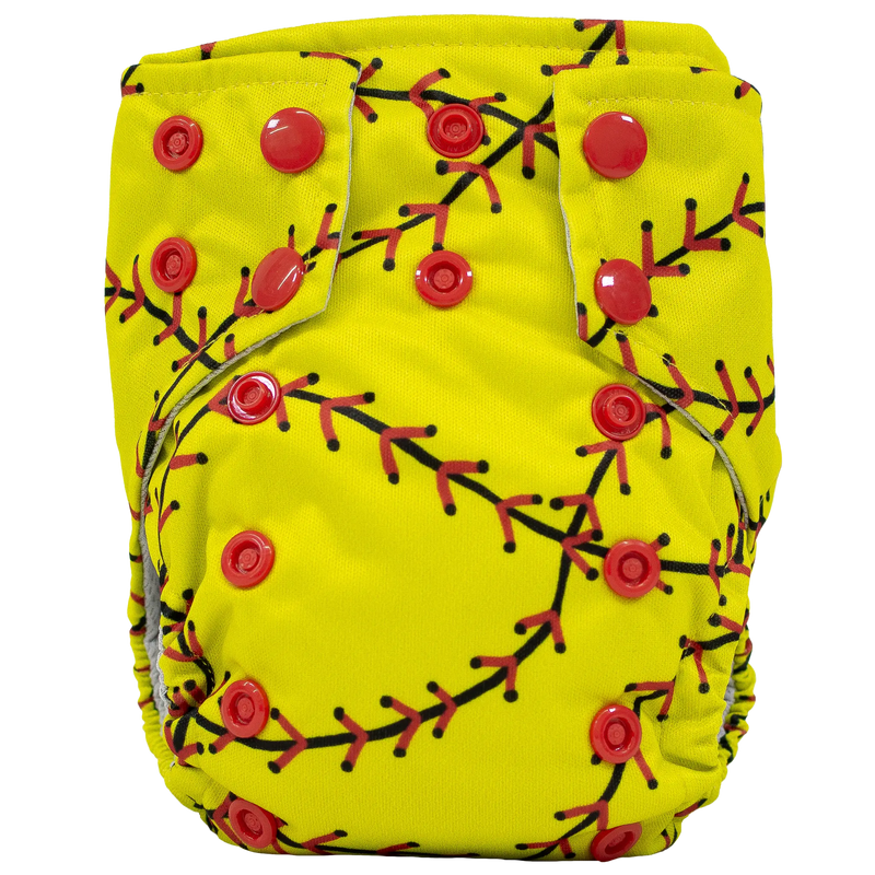 Tiny Tushies Newborn AIO Cloth Diaper with red snaps and yellow fabric featuring branch pattern.