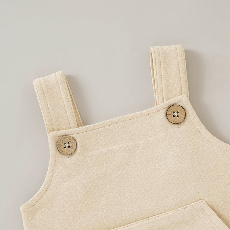 French Terry Baby Overall with buttons and front pocket in neutral color.