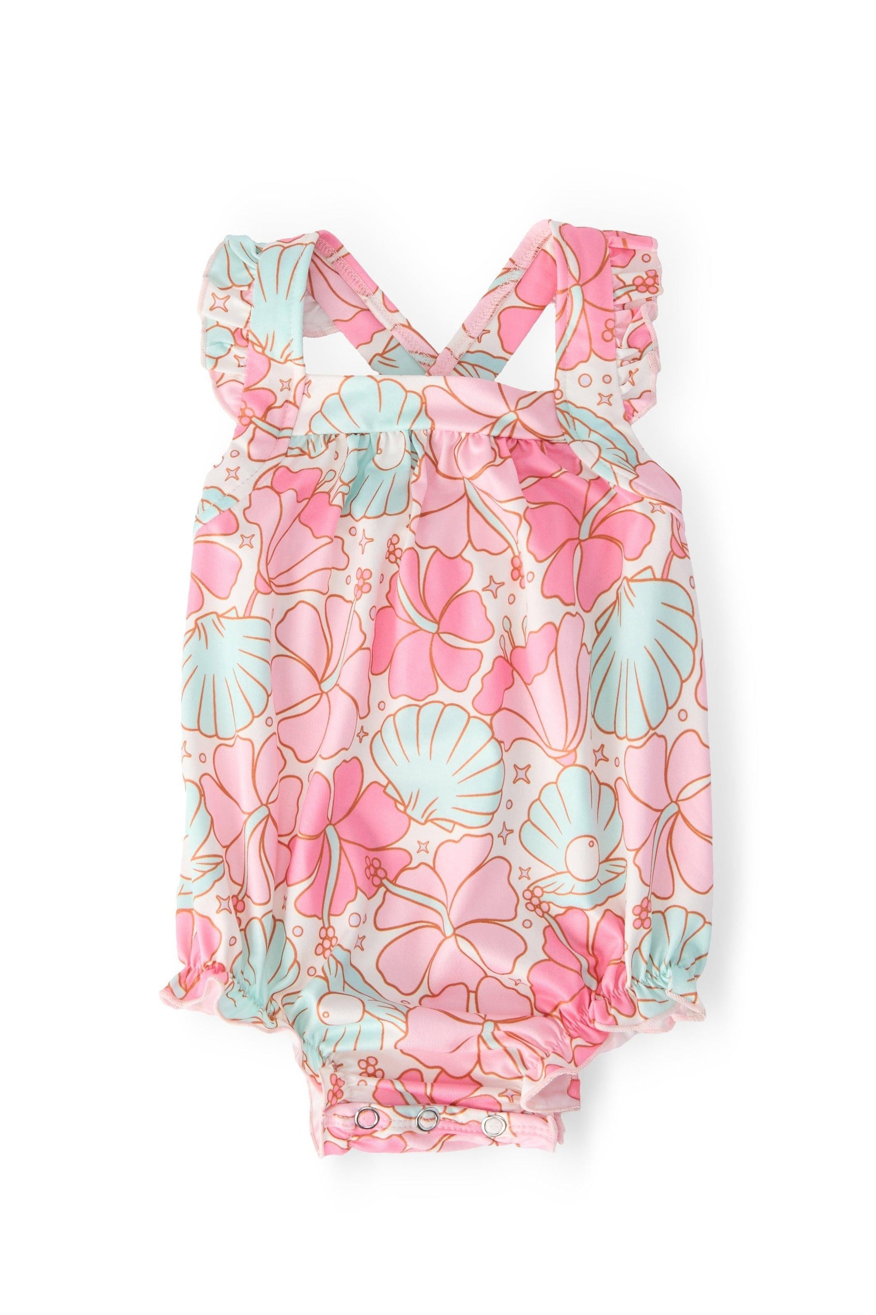 Ruffle cross back romper in Beach Daze print with shoulder ruffle and criss-cross back straps