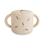 Mushie Silicone Snack Cup with lid, spill-proof design for toddlers and babies, shown in a neutral color.