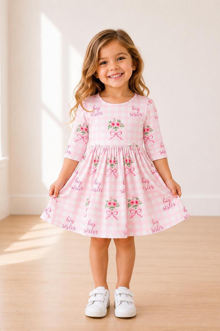 Floral twirl dress with 3/4 sleeves, pockets, ballet neckline, and a full skirt