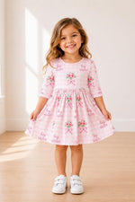 Floral twirl dress with 3/4 sleeves, pockets, ballet neckline, and a full skirt