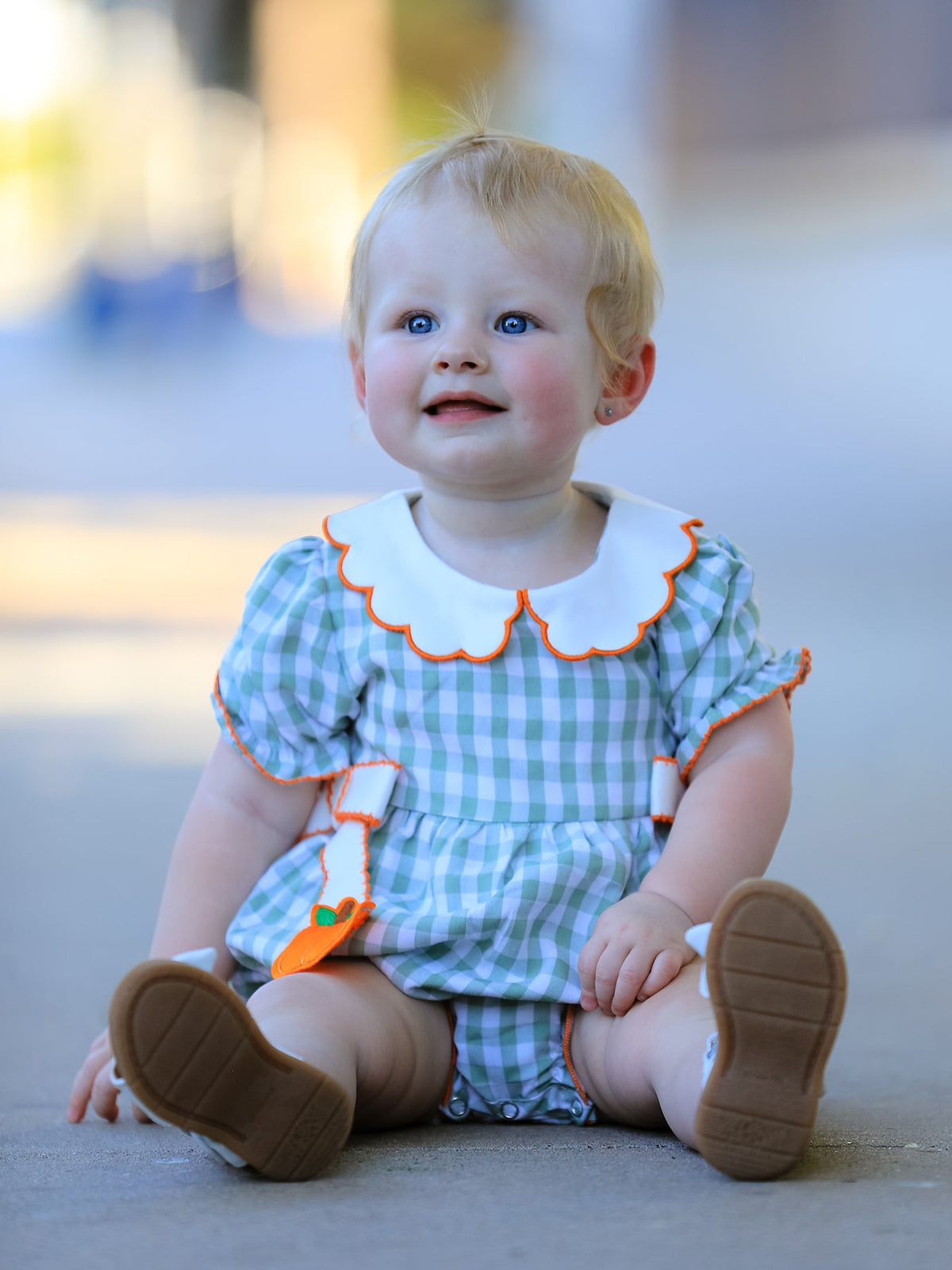 Baby girl romper in orange and white plaid with white Peter Pan collar trimmed in orange, pumpkin appliques on long white