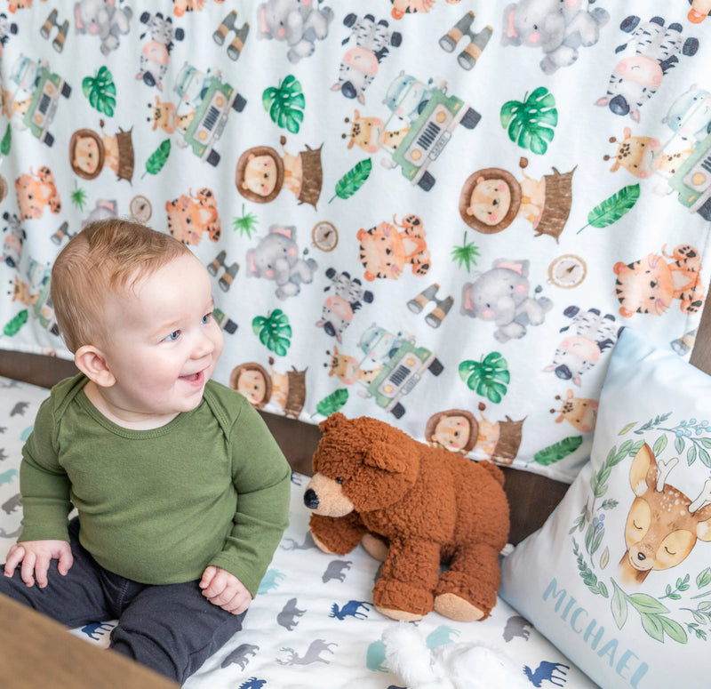 Premium Baby & Toddler Minky Blanket with Safari pattern in nursery setting.