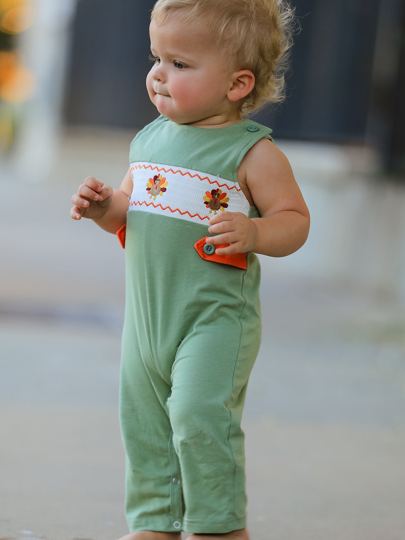 Baby boy romper with chicken smock embroidery across the chest, shown flat for a fall Thanksgiving outfit