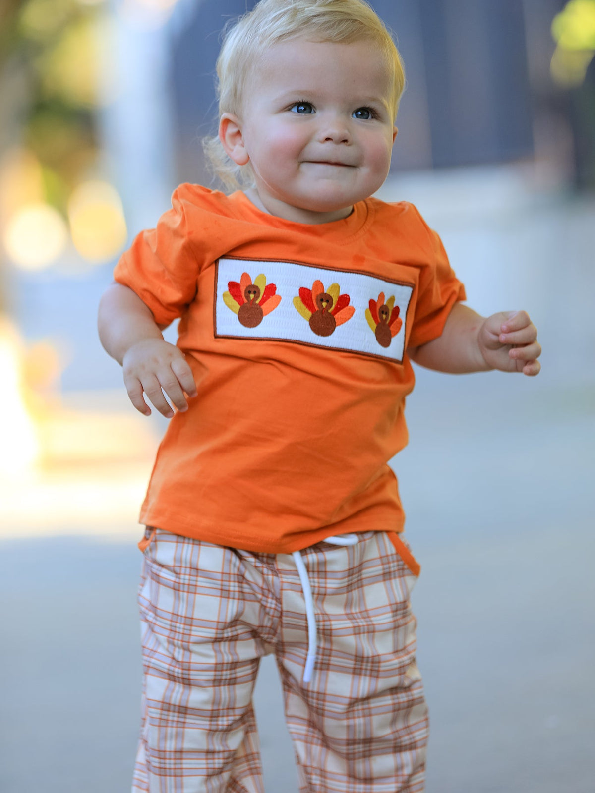 Boys two-piece set with embroidered turkey on the short-sleeve top and plaid pants with side pockets