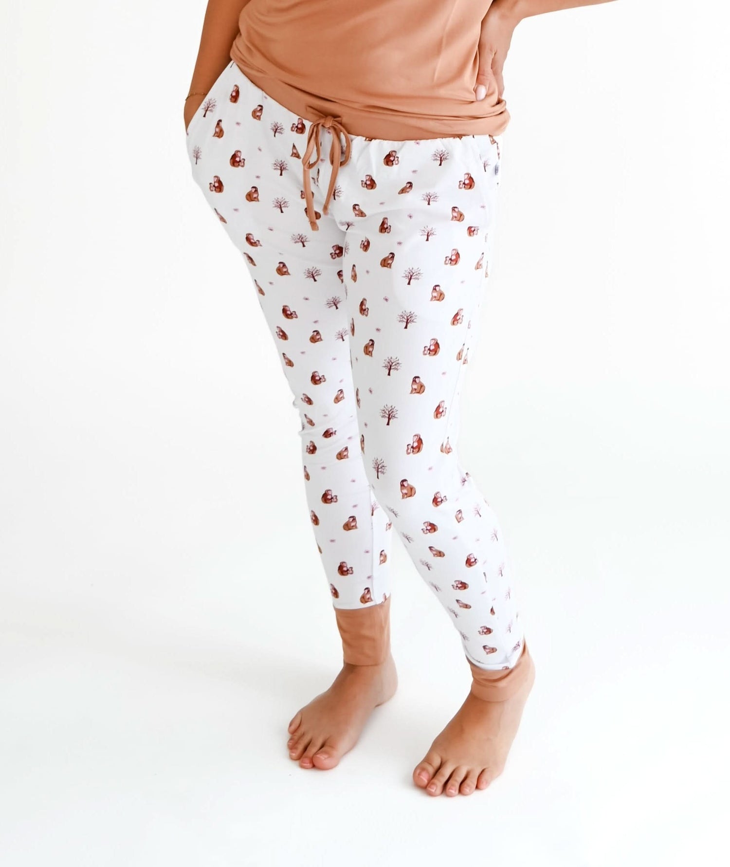 Adult joggers in a macaque print with an elastic waistband and side pockets.