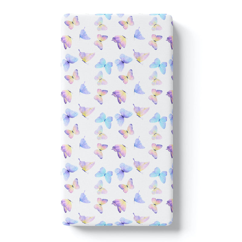 Butterfly patterned fitted crib sheet on white background.