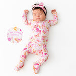 Zippered baby footie pajama with hand-drawn butterfly print and footie grips