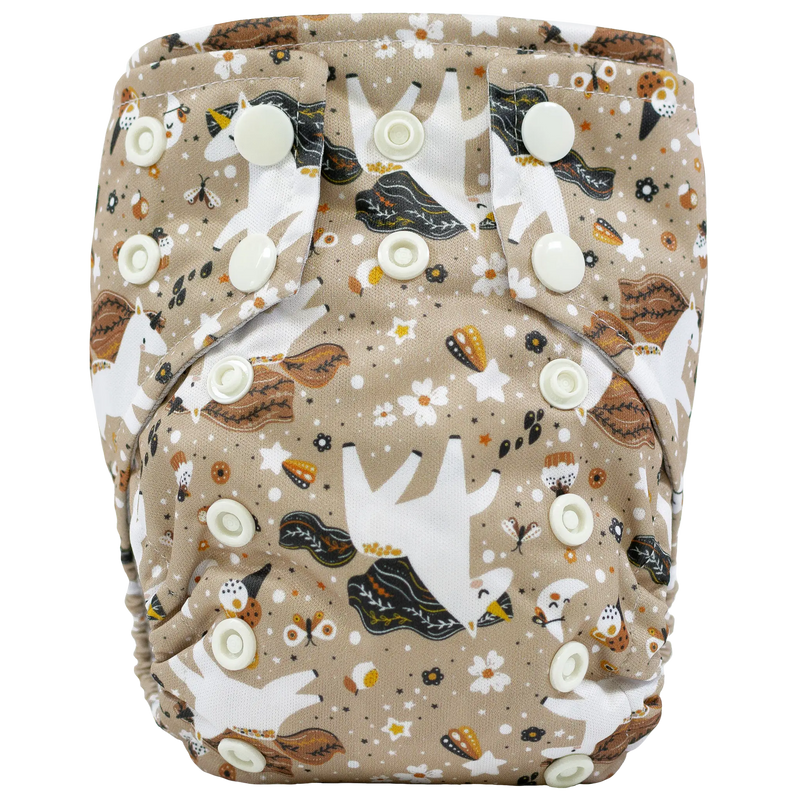 Tiny Tushies Newborn AIO Cloth Diaper with pocket opening and adjustable snaps, for 5-20 lbs, beige print.