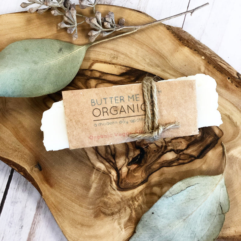 Organic Vegan Stain Stick on wooden tray with eco-friendly packaging.