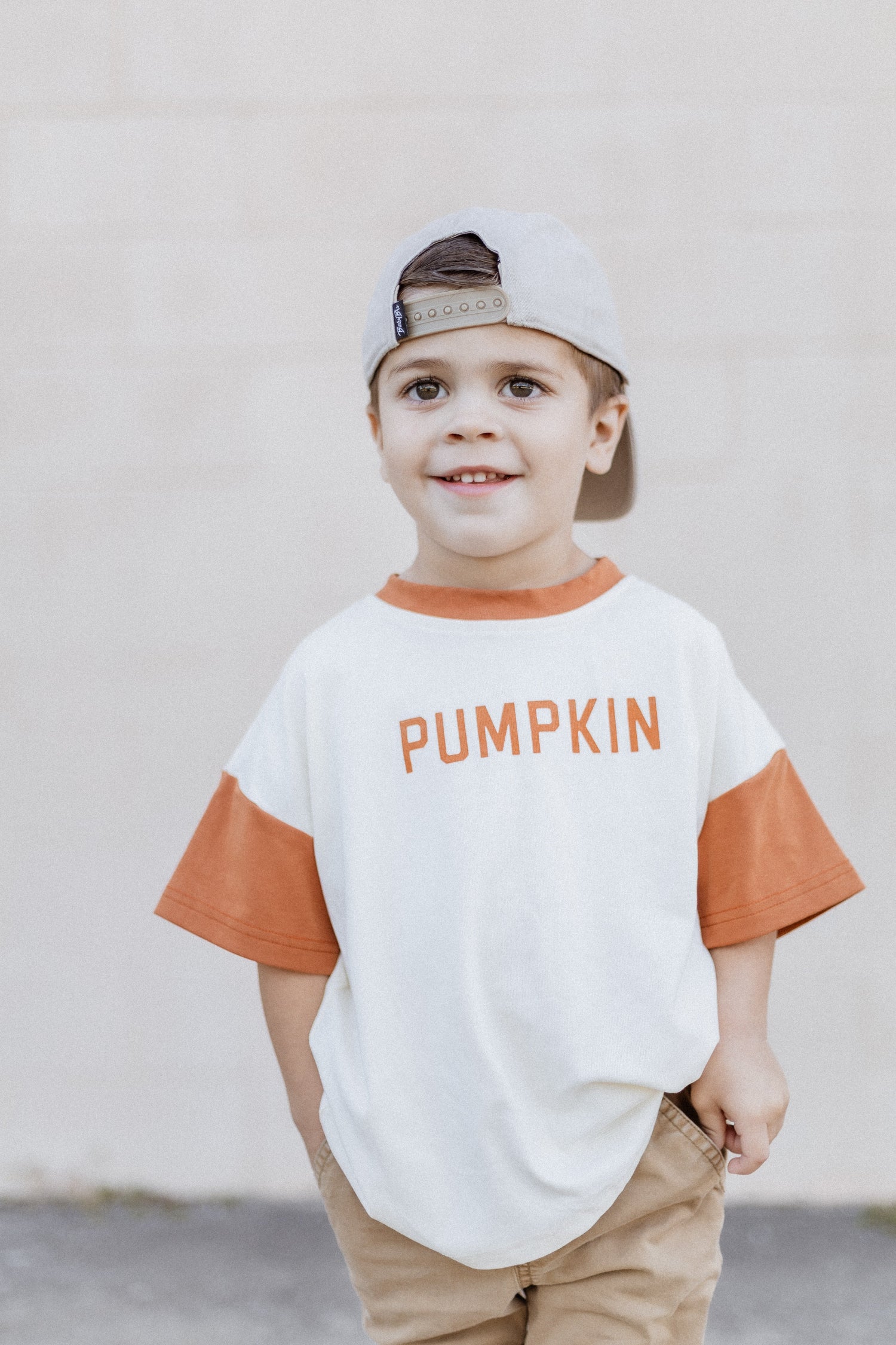 Oversized baby tee or t-shirt romper with a colorblock pumpkin design