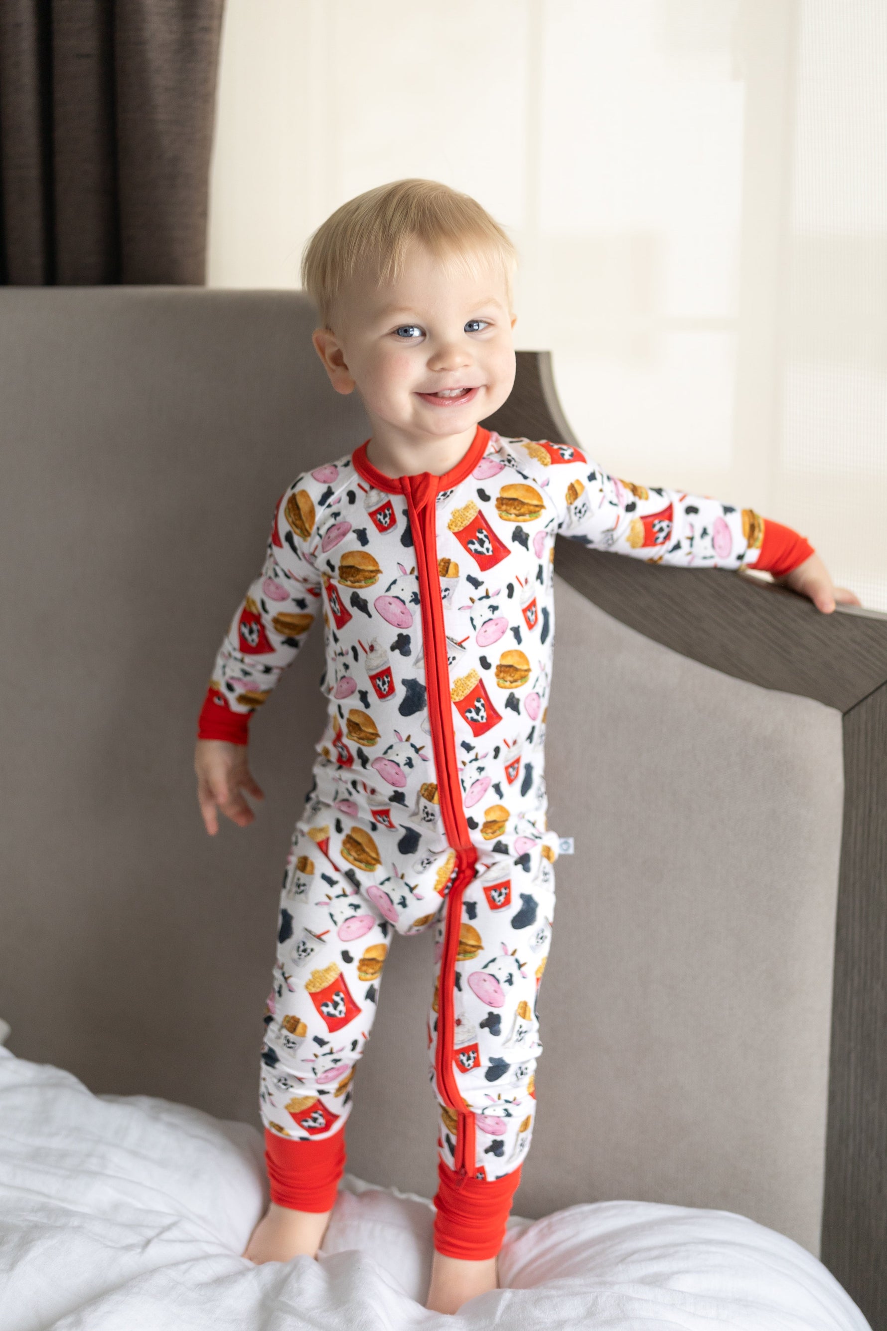 Bamboo baby romper with a full-length two-way zipper and fold-over feet