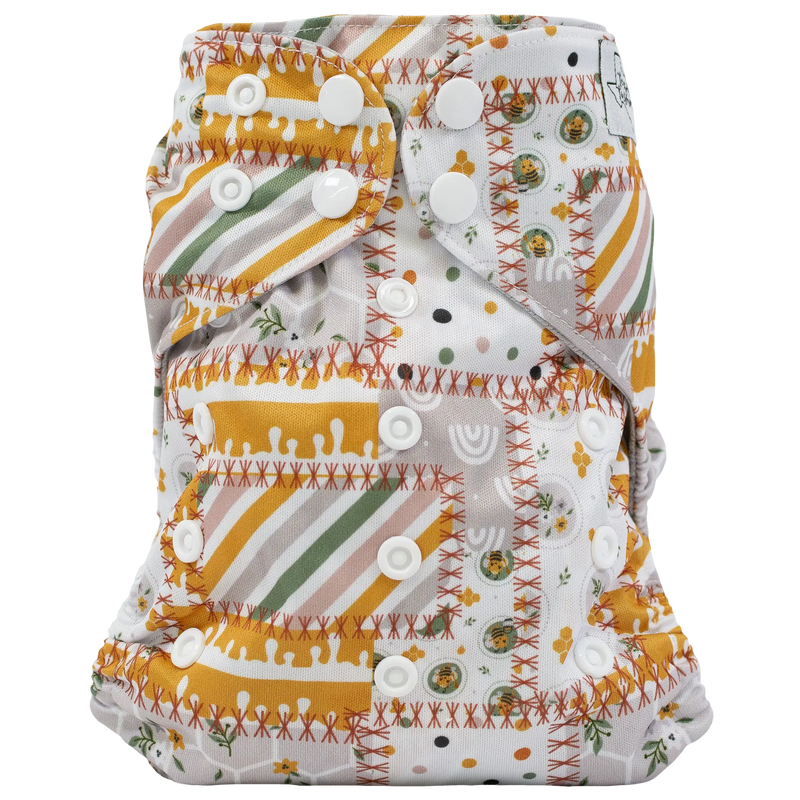 Slim Fit AIO cloth diaper with colorful print, adjustable snaps, and athletic wicking jersey fabric.