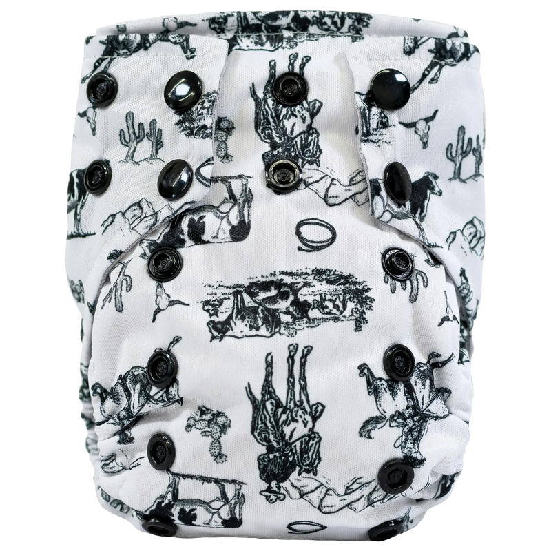 Tiny Tushies Newborn AIO Cloth Diaper with black cactus print and snaps.