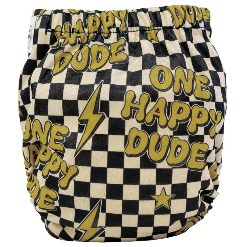 Tiny Tushies Newborn AIO Cloth Diaper with "One Happy Dude" and lightning bolt design.