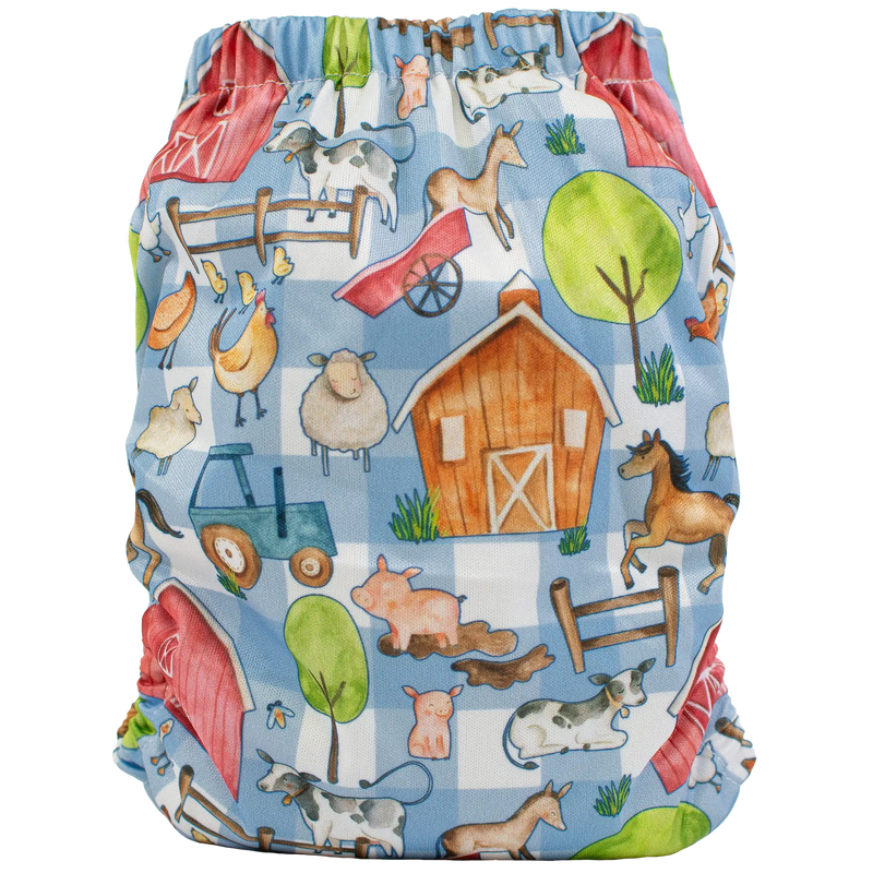 Slim fit pocket cloth diaper with farm animal print, featuring a barn, tractor, and animals.