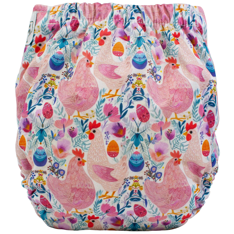 Colorful chicken print Tiny Tushies Newborn AIO cloth diaper with pocket opening for extra absorbency.