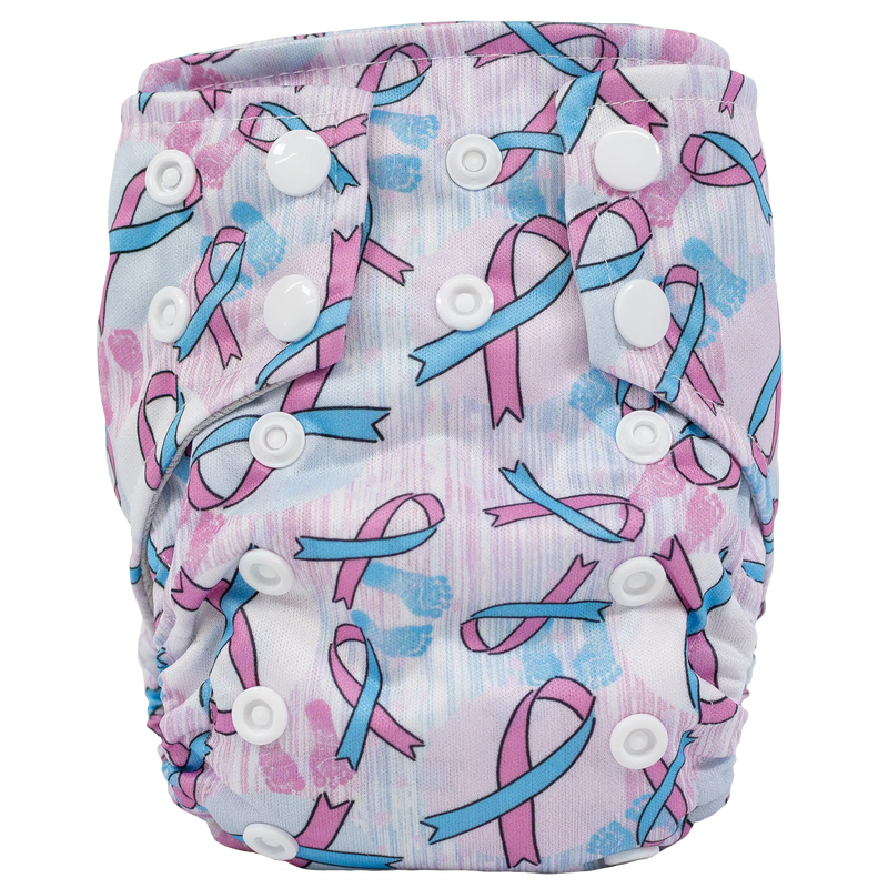 Tiny Tushies Newborn AIO Cloth Diaper with ribbon pattern and adjustable snaps.