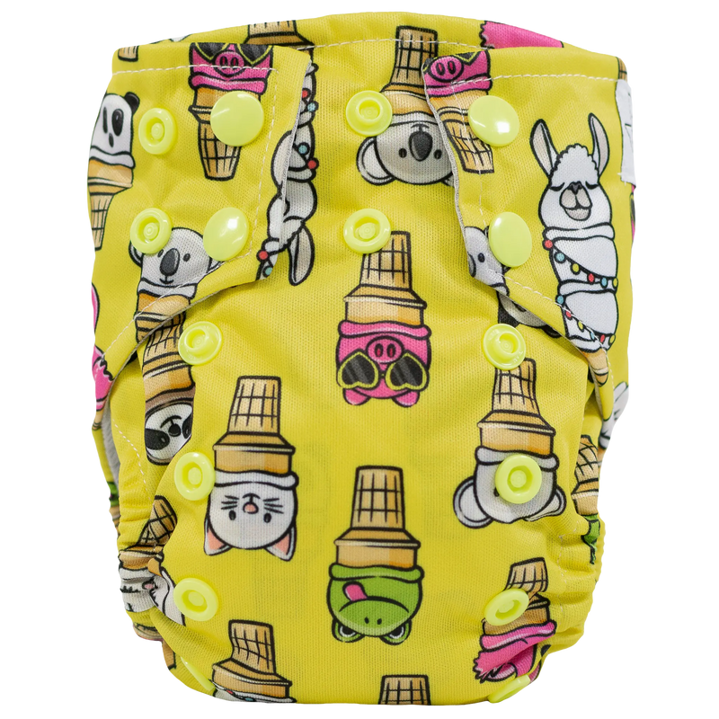 Tiny Tushies Newborn AIO Cloth Diaper with animal ice cream cone print and yellow snaps.