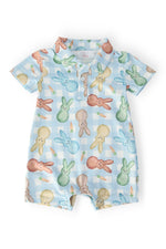 Mila & Rose baby Carrot Patch polo shorty one-piece.