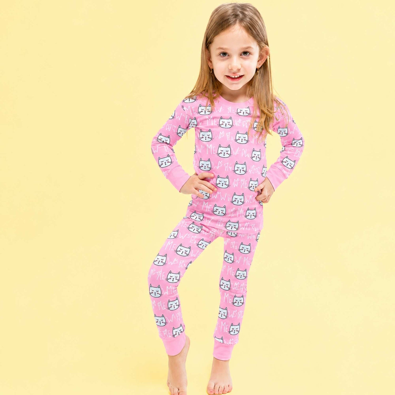 Kids two-piece pajama set with an all-over kitty cat print, long sleeve top and matching pants