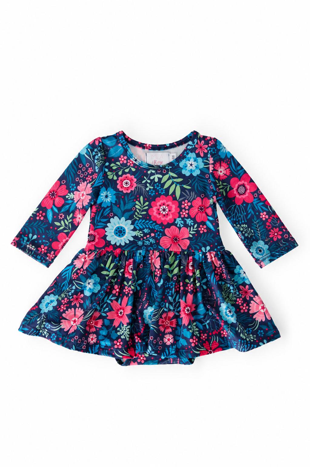 Long-sleeve baby bodysuit with attached twirl skirt in a floral gardenia print