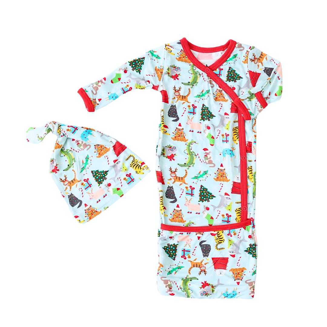 Baby convertible gown and matching hat in a Crackling Christmas holiday print with fold-over cuffs