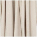 Close-up of a soft ivory coco waffle changing pad cover by Little Mae & Co. on a changing table.