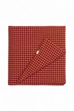 Quilted crib blanket in red and beige, hand-tufted with padding