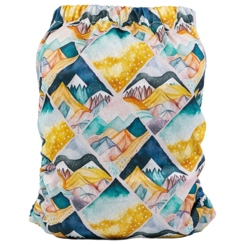 Slim Fit AIO Cloth Diaper with vibrant mountain print, athletic wicking jersey, and adjustable snaps for babies 8-40lbs.