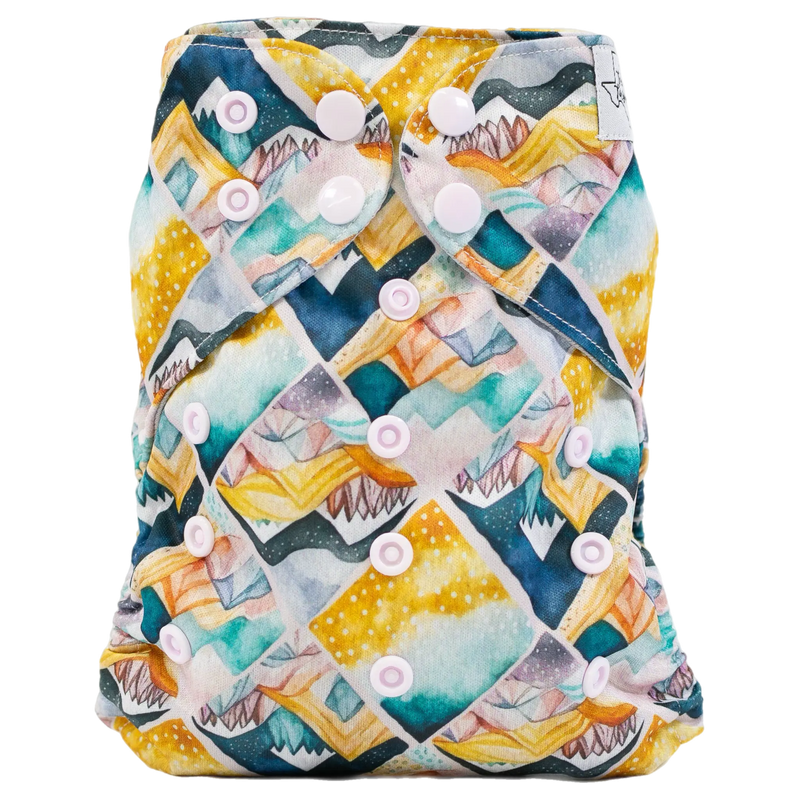 Slim fit pocket cloth diaper with colorful geometric pattern and adjustable snaps.