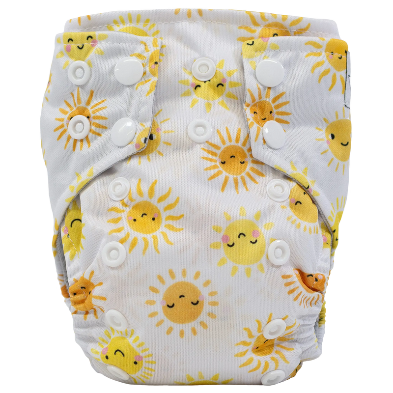 Tiny Tushies Newborn AIO Cloth Diaper with sun print and snaps.
