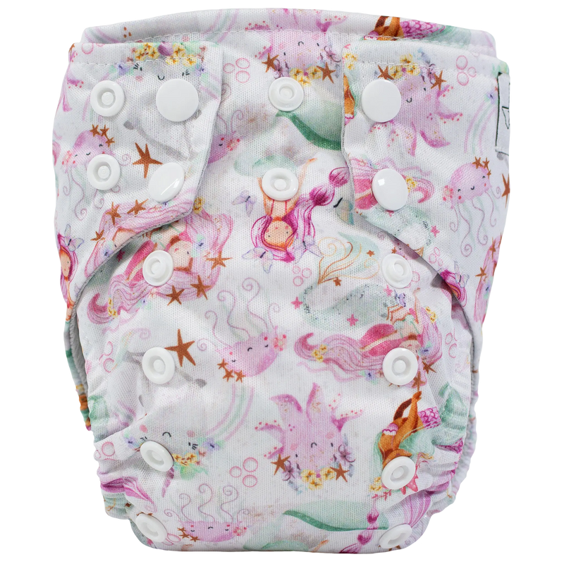 Tiny Tushies Newborn AIO cloth diaper with colorful ocean-themed print and secure snaps.