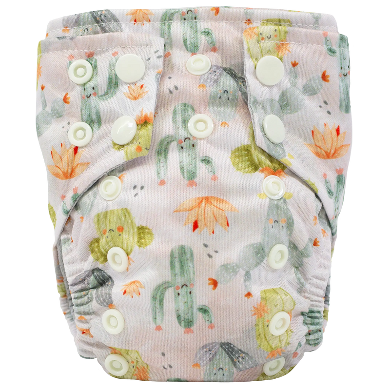 Tiny Tushies Newborn AIO Cloth Diaper with cactus design and adjustable snaps.