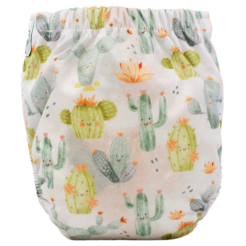 Newborn cloth diaper with cheerful cactus print, Tiny Tushies AIO design.
