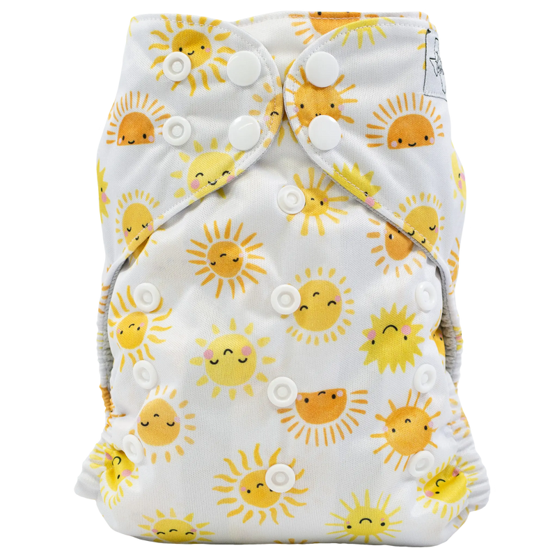 Slim fit pocket cloth diaper with sun pattern and adjustable snaps.