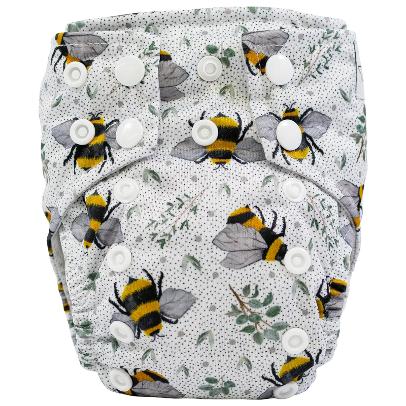 Tiny Tushies Newborn AIO Cloth Diaper with bee print and white snaps.