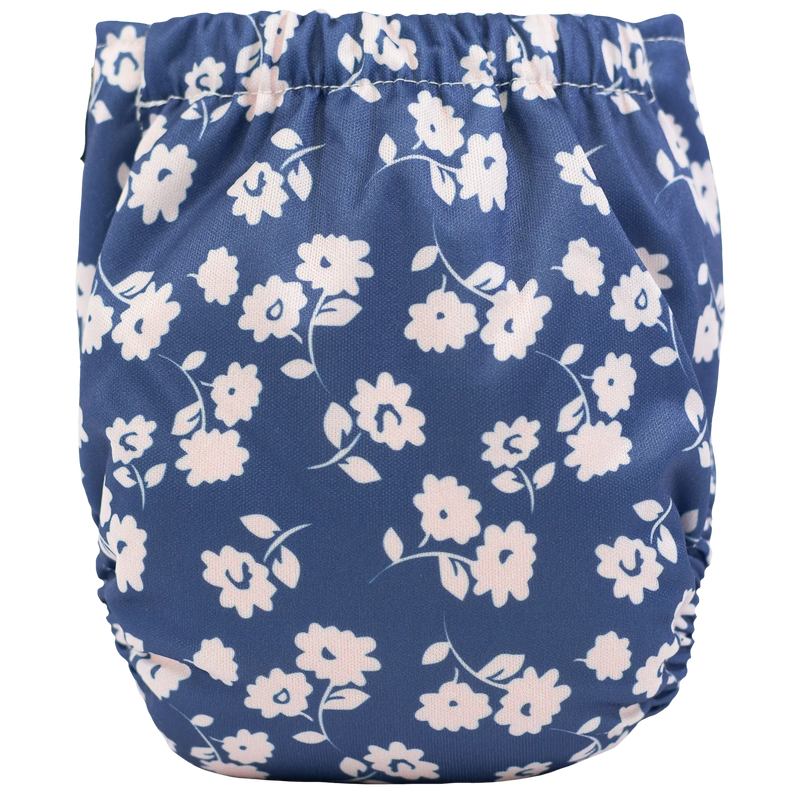 Tiny Tushies Newborn AIO Cloth Diaper with floral print.