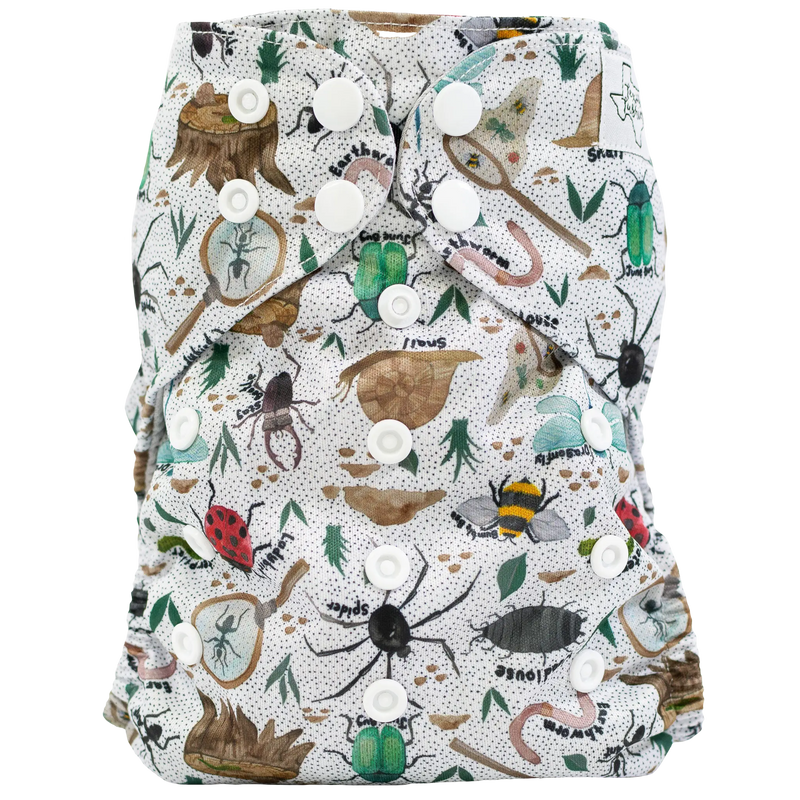 Slim Fit Pocket Cloth Diaper with nature-themed print and adjustable snaps.
