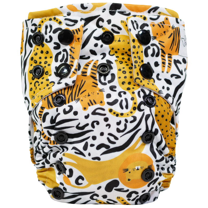 Tiny Tushies Newborn AIO cloth diaper with animal print and adjustable snaps.