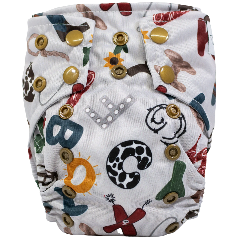 Tiny Tushies Newborn AIO Cloth Diaper with colorful alphabet print and adjustable snaps.