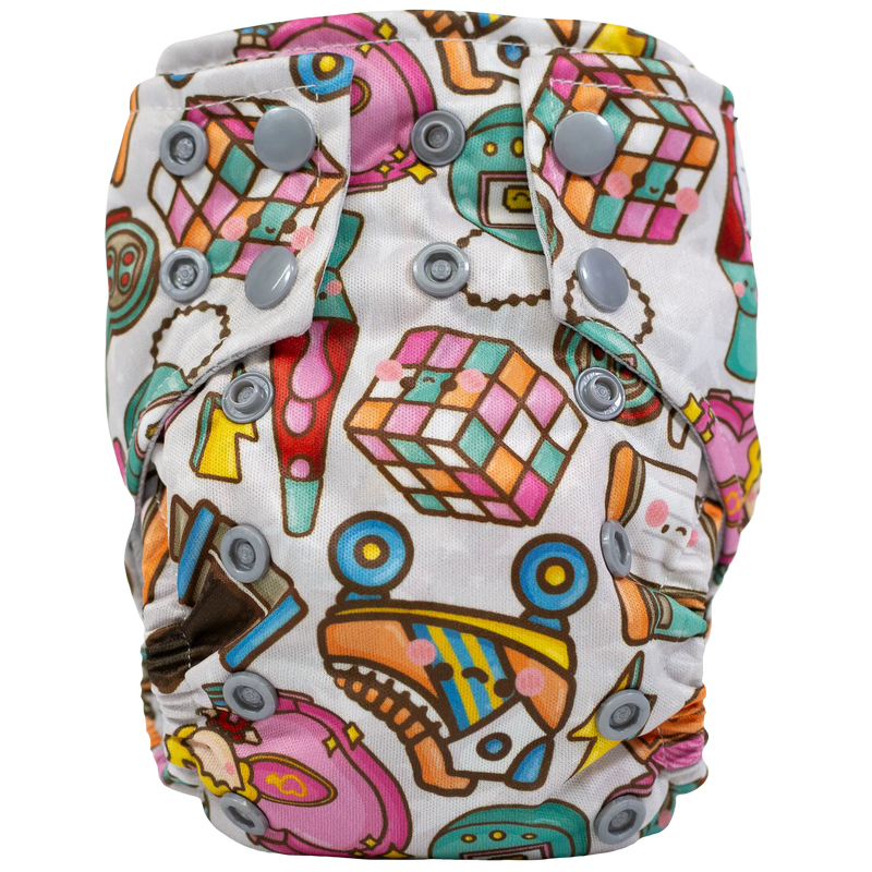 Tiny Tushies Newborn AIO Cloth Diaper with colorful printed design and adjustable snaps.