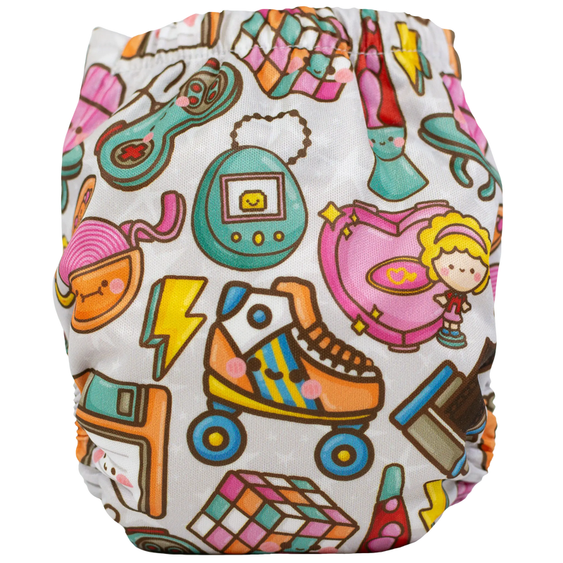 Tiny Tushies Newborn AIO Cloth Diaper with colorful playful patterns.