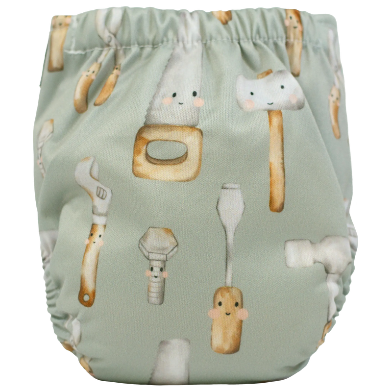 Tiny Tushies Newborn AIO cloth diaper with tool print design.