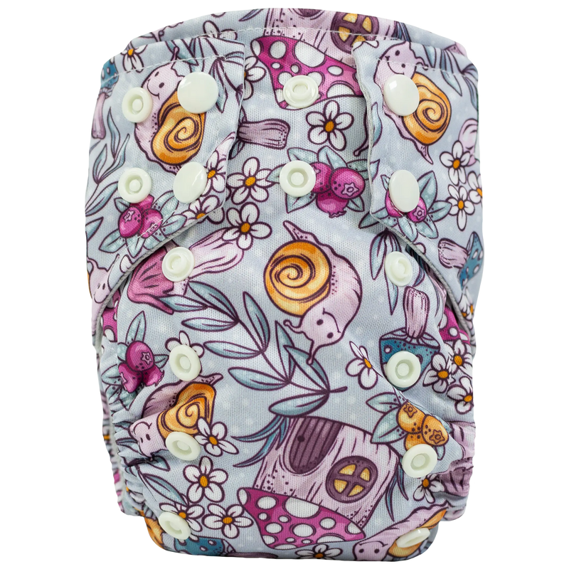 Tiny Tushies Newborn AIO Cloth Diaper with colorful animal and floral print.
